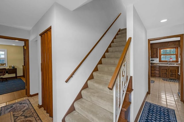 staircase with tile patterned flooring, recessed lighting, and baseboards
