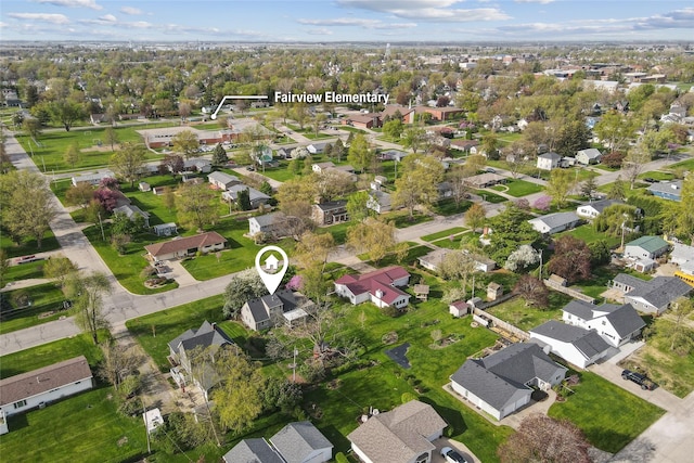 birds eye view of property with a residential view