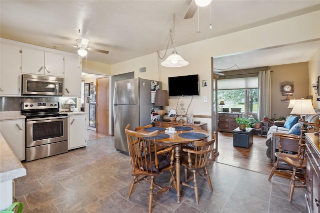 dining area with ceiling fan