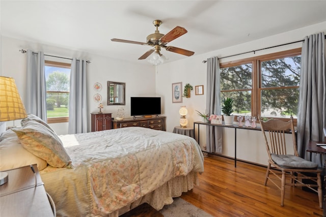 bedroom featuring a ceiling fan and wood finished floors