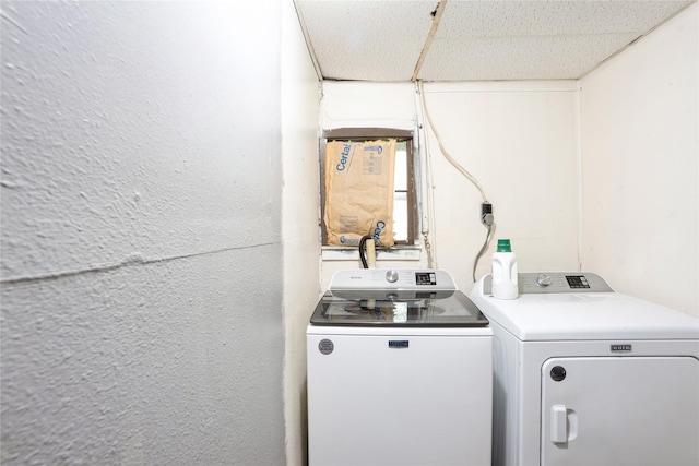 washroom featuring laundry area and washing machine and dryer