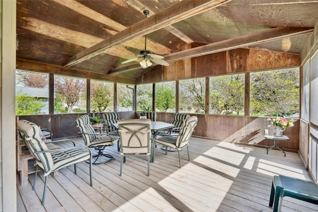 sunroom / solarium with plenty of natural light, outdoor dining space, and ceiling fan
