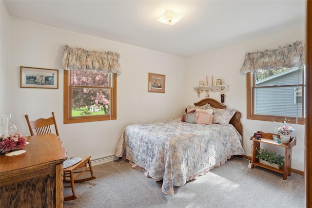 carpeted bedroom featuring baseboards