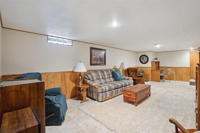 tiled living room featuring wooden walls and a wainscoted wall