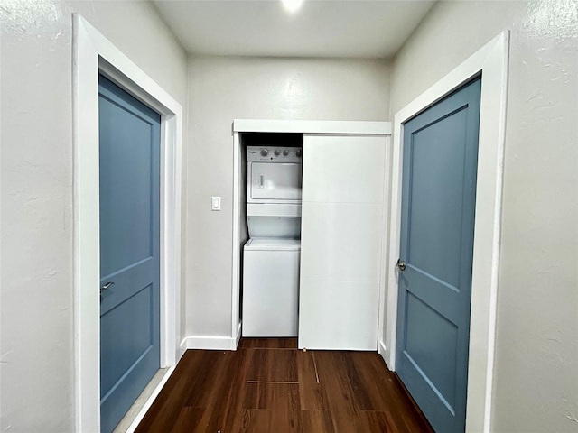 3825 15th St, Des Moines, IA 50313 - laundry area featuring stacked washer / dryer and dark wood-type flooring