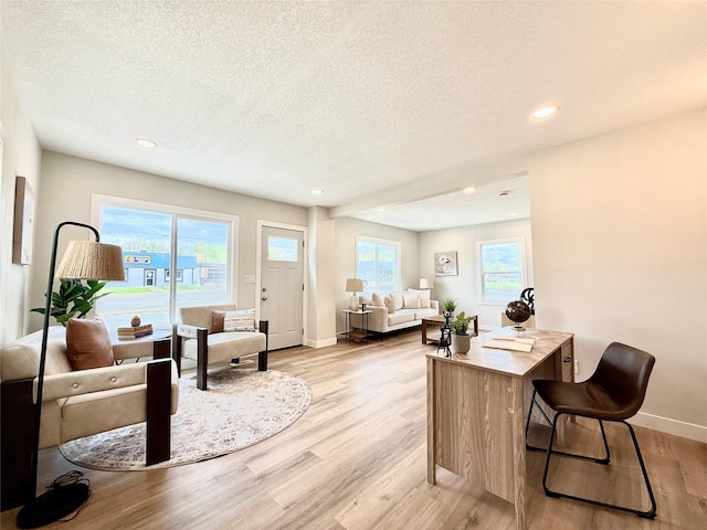 4825 SW 9th St, Des Moines, IA 50315 - home office featuring a textured ceiling, light wood-style flooring, baseboards, and recessed lighting