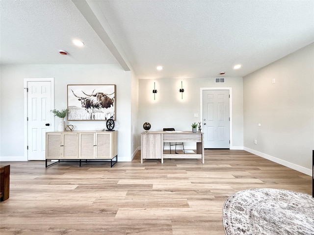 4825 SW 9th St, Des Moines, IA 50315 - living area with a textured ceiling, light wood finished floors, baseboards, and recessed lighting