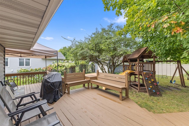 727 SE Richland Ct, Ankeny, IA 50021 - wooden terrace featuring a playground and a grill