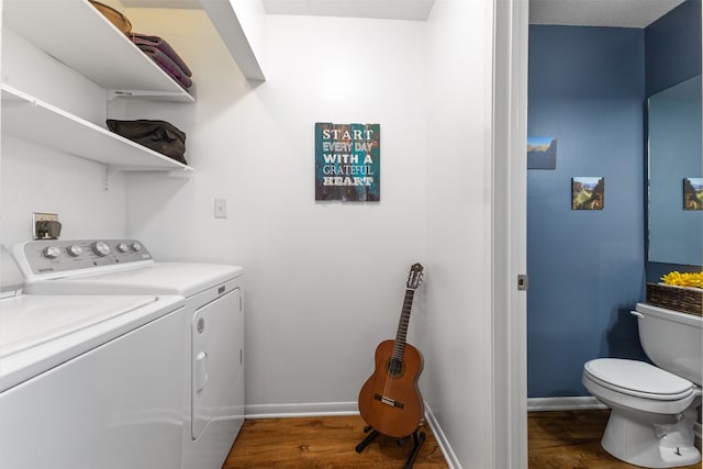 727 SE Richland Ct, Ankeny, IA 50021 - washroom featuring washer and dryer, wood finished floors, and baseboards