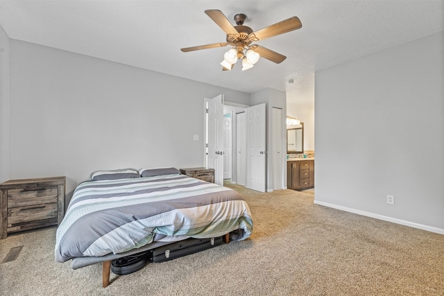 727 SE Richland Ct, Ankeny, IA 50021 - bedroom featuring carpet floors, baseboards, ensuite bath, and ceiling fan