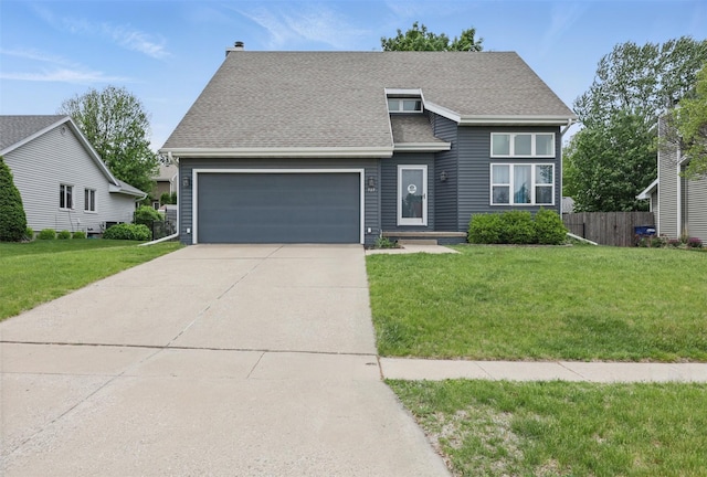 727 SE Richland Ct, Ankeny, IA 50021 - view of front facade with an attached garage, roof with shingles, and concrete driveway