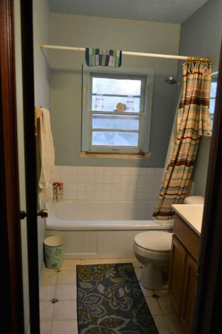 bathroom with tile patterned floors, toilet, and vanity