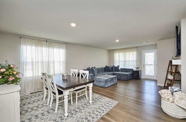 1150 NW Williamsburg Ln, Waukee, IA 50263 - dining area with wood finished floors and recessed lighting