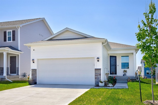 1150 NW Williamsburg Ln, Waukee, IA 50263 - view of front facade featuring driveway, an attached garage, a front yard, and stone siding