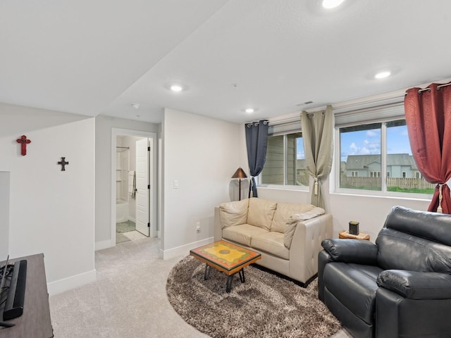 living area with light carpet, baseboards, visible vents, and recessed lighting