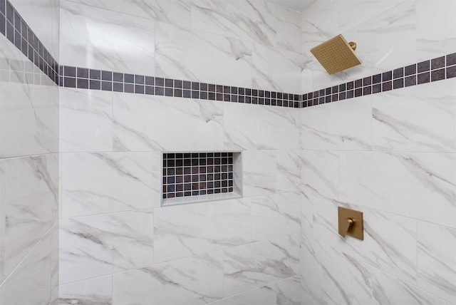 full bath with tiled shower