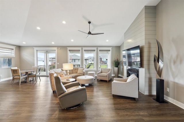 living room featuring ceiling fan, a wealth of natural light, dark wood-type flooring, and recessed lighting