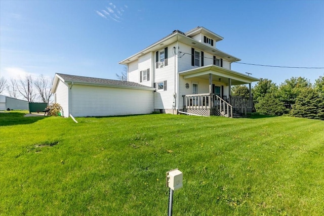 1208 310th Ave, Malcom, IA 50157 - rear view of property with a lawn and covered porch