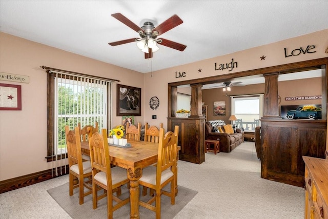 1208 310th Ave, Malcom, IA 50157 - dining area with a healthy amount of sunlight, ceiling fan, and light colored carpet