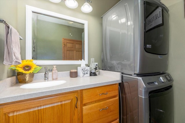 1208 310th Ave, Malcom, IA 50157 - bathroom with stacked washer / dryer and vanity