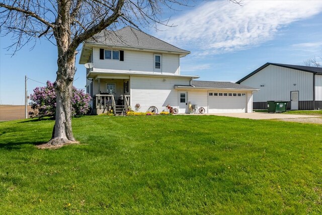 1208 310th Ave, Malcom, IA 50157 - exterior space featuring concrete driveway, an attached garage, a front yard, and central air condition unit