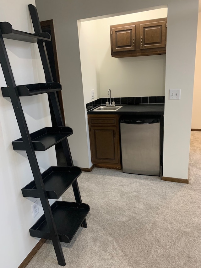 6750 School St Unit 1016, Windsor Heights, IA 50324 - bar featuring light colored carpet, indoor wet bar, a sink, and dishwasher