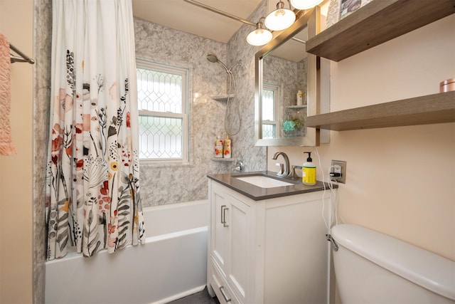 bathroom featuring vanity, shower / bathtub combination with curtain, and toilet