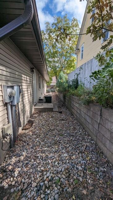 view of home's exterior with fence