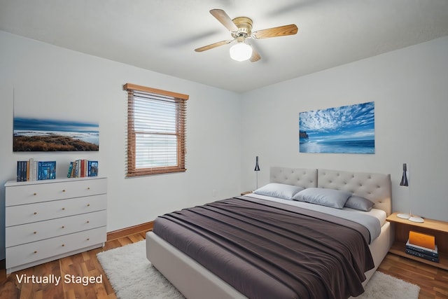 bedroom with ceiling fan and wood finished floors