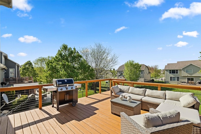 deck featuring an outdoor hangout area, a residential view, and grilling area