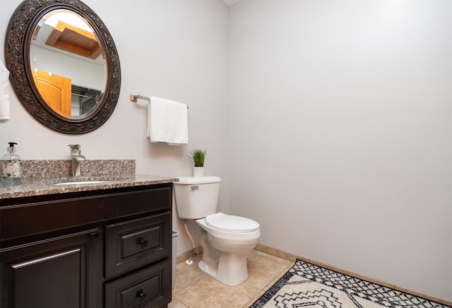 4110 140th St, Urbandale, IA 50323 - bathroom with toilet, baseboards, vanity, and tile patterned flooring