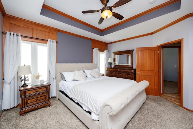 4110 140th St, Urbandale, IA 50323 - bedroom featuring crown molding, light carpet, a raised ceiling, and ceiling fan