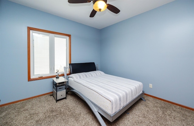 4110 140th St, Urbandale, IA 50323 - bedroom with light colored carpet, baseboards, and a ceiling fan