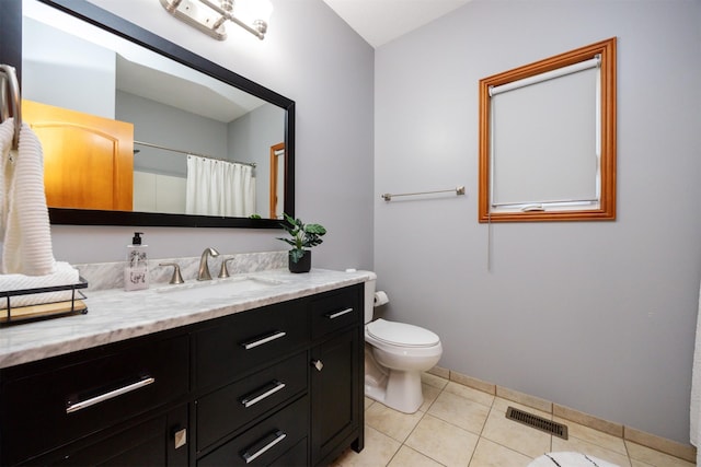 4110 140th St, Urbandale, IA 50323 - bathroom with toilet, visible vents, baseboards, tile patterned flooring, and vanity