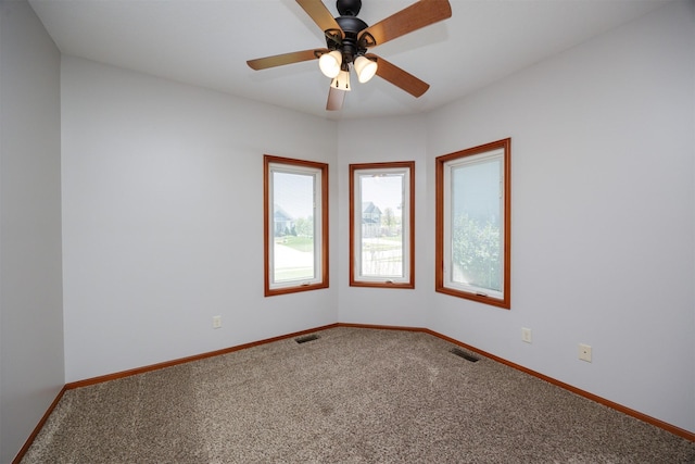 4110 140th St, Urbandale, IA 50323 - empty room with baseboards, carpet flooring, visible vents, and a ceiling fan