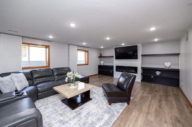 4110 140th St, Urbandale, IA 50323 - living area featuring baseboards, recessed lighting, visible vents, and wood finished floors