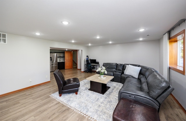 4110 140th St, Urbandale, IA 50323 - living area with light wood finished floors, baseboards, visible vents, and recessed lighting