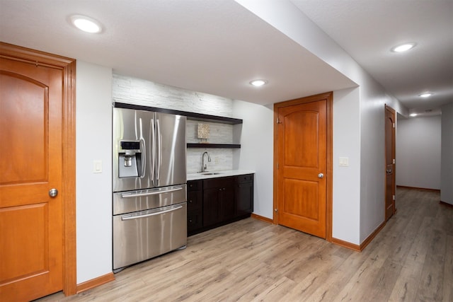 4110 140th St, Urbandale, IA 50323 - kitchen featuring light wood-style flooring, stainless steel fridge with ice dispenser, open shelves, and a sink