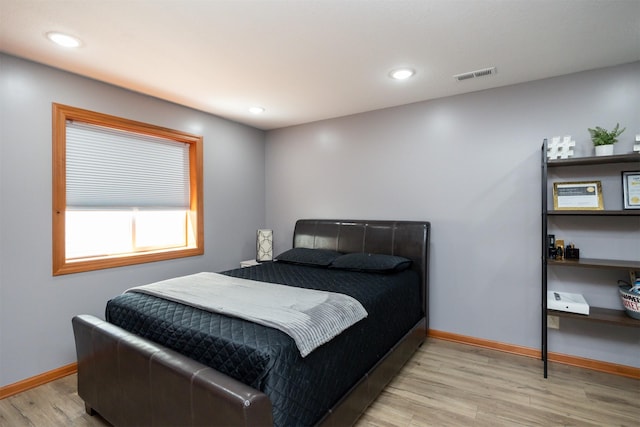 4110 140th St, Urbandale, IA 50323 - bedroom with light wood-style floors, visible vents, baseboards, and recessed lighting