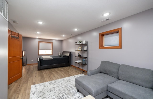 4110 140th St, Urbandale, IA 50323 - living room featuring baseboards, recessed lighting, light wood-style flooring, and visible vents
