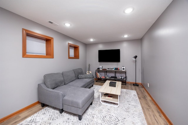 4110 140th St, Urbandale, IA 50323 - living area featuring recessed lighting, baseboards, visible vents, and light wood-style floors