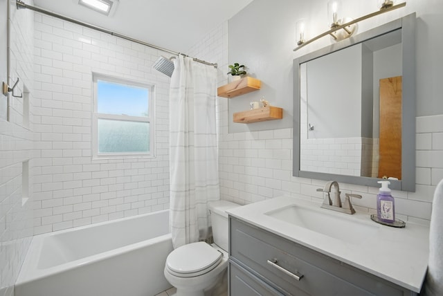 bathroom with toilet, tile walls, vanity, and shower / bathtub combination with curtain