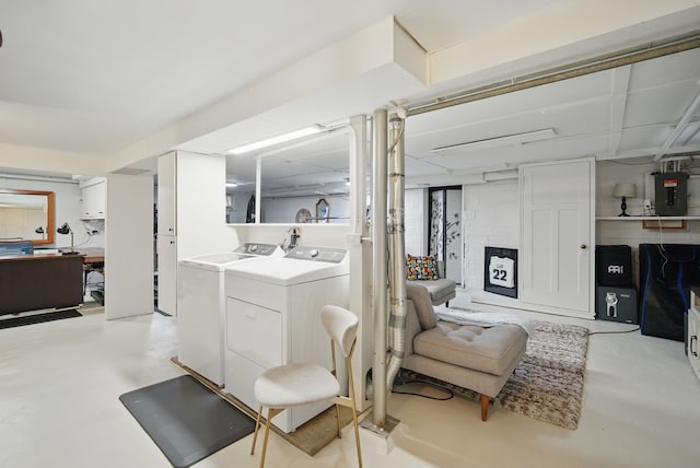 laundry area featuring electric panel, laundry area, and independent washer and dryer
