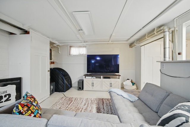 living area with concrete flooring