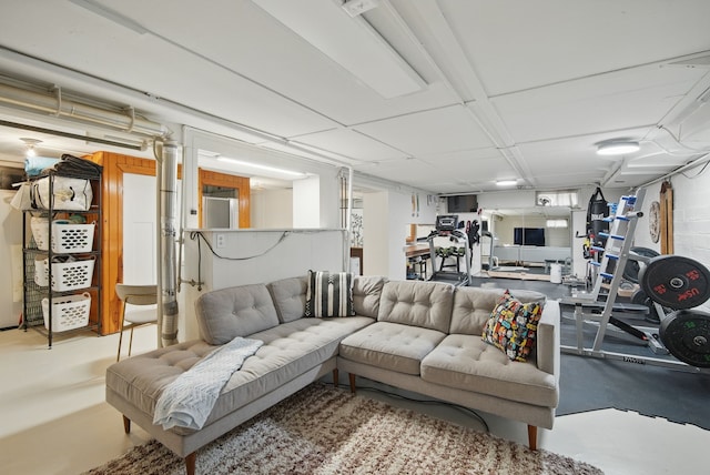 living area featuring concrete floors