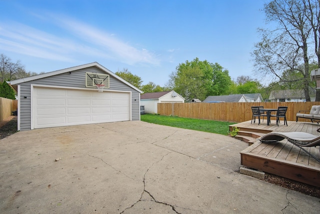 detached garage featuring fence