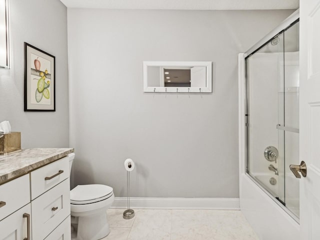 bathroom with toilet, marble finish floor, vanity, combined bath / shower with glass door, and baseboards