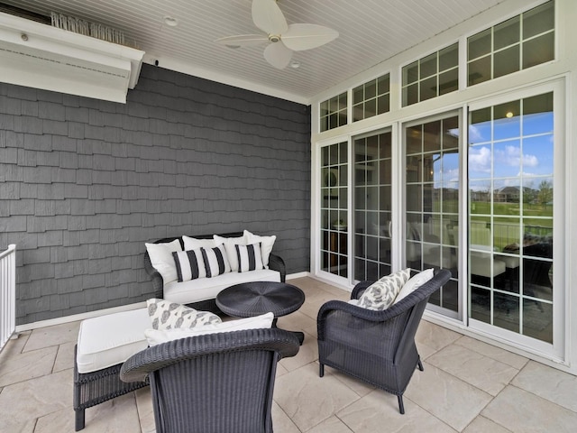view of patio featuring a ceiling fan and an AC wall unit