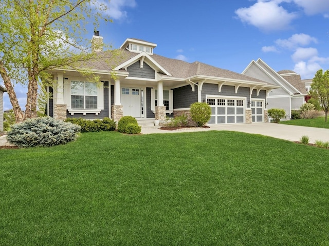 craftsman-style house featuring an attached garage, stone siding, driveway, a front yard, and a chimney