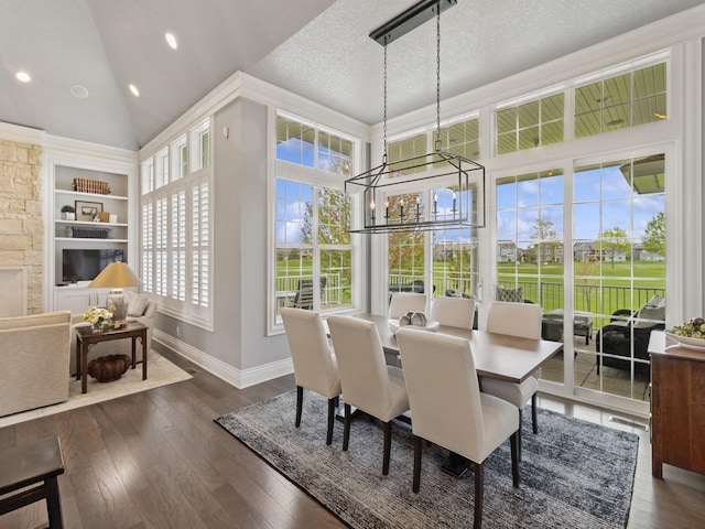 dining space with wood finished floors, high vaulted ceiling, built in features, baseboards, and recessed lighting